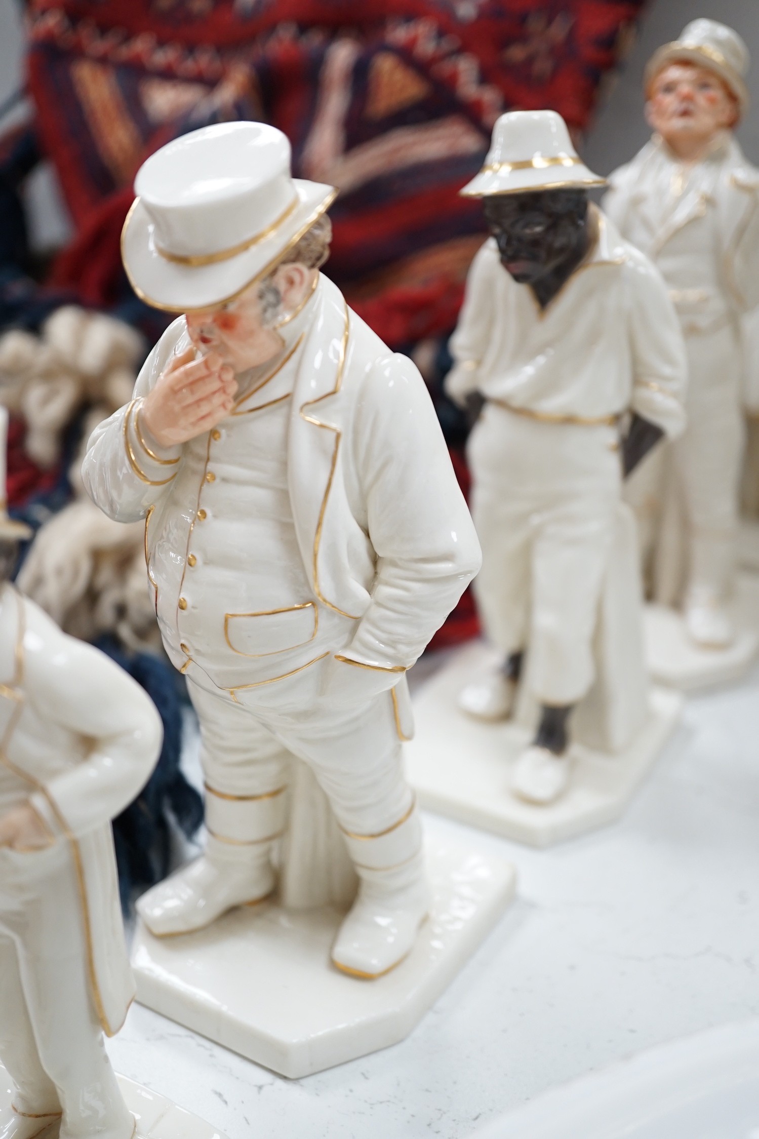 Seven Royal Worcester Hadleys figures of the World, tallest 17.5 cm